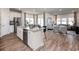 Open concept kitchen with island, stainless steel appliances, and adjacent living area at 1212 Arizona Dr., Longs, SC 29568