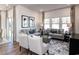 Comfortable living room featuring a gray sectional sofa and ample natural light at 1212 Arizona Dr., Longs, SC 29568