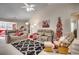 Relaxing living room with vaulted ceiling, comfortable seating, and a Christmas tree at 160 Somerworth Circle, Surfside Beach, SC 29575