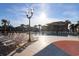 Community pool with lounge chairs and palm trees at 1819 N Ocean Blvd. # 1004, North Myrtle Beach, SC 29582