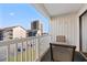 Balcony with table and chairs overlooking street and ocean at 191 Maison Dr. # B203, Myrtle Beach, SC 29572