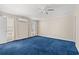 Spacious bedroom with blue carpet and ceiling fan at 2017 Silver Spring Ln., Myrtle Beach, SC 29577