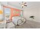 Spacious bedroom featuring a ceiling fan and coral accent wall at 2017 Silver Spring Ln., Myrtle Beach, SC 29577