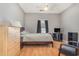 Cozy bedroom with a double bed, dresser, and a sitting chair at 2740 Bayboro St., Loris, SC 29569