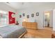 Bedroom with a dresser, laundry access, and a serene Asian-inspired decor at 2740 Bayboro St., Loris, SC 29569