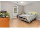 Cozy bedroom with light wood floors, a yellow headboard, and a ceiling fan at 2740 Bayboro St., Loris, SC 29569