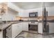 White kitchen with stainless steel appliances and dark countertops at 2740 Bayboro St., Loris, SC 29569