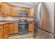 Kitchen with wood cabinets, stainless steel appliances, and granite countertops at 2740 Bayboro St., Loris, SC 29569