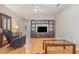 Living room with hardwood floors, a large TV stand and a recliner at 2740 Bayboro St., Loris, SC 29569