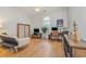 Bright office space with hardwood floors, a built-in desk, and a comfortable sofa at 2740 Bayboro St., Loris, SC 29569