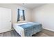 Cozy bedroom with a double bed and blue blanket at 416 Bearskin Ct., Longs, SC 29568