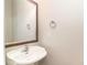 Small bathroom with pedestal sink, mirror, and chrome fixtures at 517 Miromar Way, Myrtle Beach, SC 29588