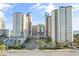Oceanfront resort with multiple buildings, parking, and palm trees at 5200 N Ocean Blvd. # 1033, Myrtle Beach, SC 29577
