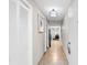 Bright hallway with tiled floor, white closet, and view into living area at 5200 N Ocean Blvd. # 1033, Myrtle Beach, SC 29577