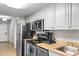 Modern kitchen with stainless steel appliances and light cabinets at 5200 N Ocean Blvd. # 1033, Myrtle Beach, SC 29577