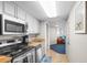 Open kitchen with stainless steel appliances and light wood cabinets at 5200 N Ocean Blvd. # 1033, Myrtle Beach, SC 29577