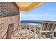 Private balcony with ocean view and patio furniture at 5910 N Ocean Blvd. # 504, North Myrtle Beach, SC 29582