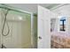 Simple bathroom with shower/tub and bedroom access at 5910 N Ocean Blvd. # 504, North Myrtle Beach, SC 29582