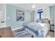 Serene bedroom featuring a queen bed and coastal art at 5910 N Ocean Blvd. # 504, North Myrtle Beach, SC 29582