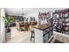 Open dining area with a rustic farmhouse table and wicker chairs at 6205 Nixon St., North Myrtle Beach, SC 29582