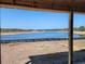 Peaceful waterfront view of a pond from under a covered porch at 723 Isle Verde Dr, Myrtle Beach, SC 29579