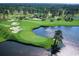 Aerial view of a lush green golf course with water features at 727 Isle Verde Dr, Myrtle Beach, SC 29579