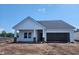 Newly constructed one-story home with white siding and a gray roof at 727 Isle Verde Dr, Myrtle Beach, SC 29579