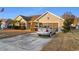 House exterior with driveway and basketball hoop at 818 Ingle Nook Ln., Longs, SC 29568