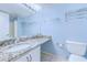 Bathroom with granite countertop, shower/tub combo, and blue walls at 9500 Shore Dr. # 12B, Myrtle Beach, SC 29572