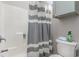 Clean bathroom with shower/tub and striped curtain at 101 S Barnwell St. # 38-A, North Myrtle Beach, SC 29582