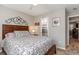 Bedroom with double bed, access to bathroom and ceiling fan at 101 S Barnwell St. # 38-A, North Myrtle Beach, SC 29582
