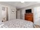 Bedroom with double bed, dresser and ensuite bathroom at 101 S Barnwell St. # 38-A, North Myrtle Beach, SC 29582