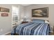 Bedroom with single bed, ensuite bathroom and window with shutters at 101 S Barnwell St. # 38-A, North Myrtle Beach, SC 29582