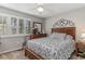 Bedroom with double bed, window with shutters and ceiling fan at 101 S Barnwell St. # 38-A, North Myrtle Beach, SC 29582