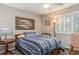 Bedroom with single bed, window with shutters and ceiling fan at 101 S Barnwell St. # 38-A, North Myrtle Beach, SC 29582