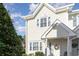 Inviting two-story townhome with light yellow siding and a charming front porch at 101 S Barnwell St. # 38-A, North Myrtle Beach, SC 29582