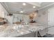 Spacious kitchen with granite countertops and breakfast bar at 101 S Barnwell St. # 38-A, North Myrtle Beach, SC 29582