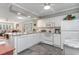 Modern kitchen with white cabinetry, granite countertops, and stainless steel appliances at 101 S Barnwell St. # 38-A, North Myrtle Beach, SC 29582