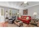 Living room with hardwood floors, comfortable seating, and large windows at 101 S Barnwell St. # 38-A, North Myrtle Beach, SC 29582