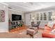 Bright living room featuring hardwood floors, comfortable seating, and a large TV at 101 S Barnwell St. # 38-A, North Myrtle Beach, SC 29582