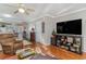 Open concept living room with hardwood floors and view of kitchen at 101 S Barnwell St. # 38-A, North Myrtle Beach, SC 29582