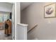 View of carpeted stairs and hallway at 101 S Barnwell St. # 38-A, North Myrtle Beach, SC 29582