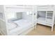 Two sets of bunk beds with white bedding at 1017 S Dogwood Dr., Surfside Beach, SC 29575