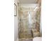 Large walk-in shower with tiled walls and a built-in seat at 1017 S Dogwood Dr., Surfside Beach, SC 29575