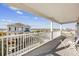 Covered balcony with water views and neighboring houses at 1050 Waccamaw Dr., Garden City Beach, SC 29576