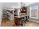 Modern kitchen with dark wood cabinets, granite countertops, and an island with seating at 1050 Waccamaw Dr., Garden City Beach, SC 29576