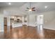 Open living room and kitchen with high ceilings, hardwood floors and ceiling fan at 1101 Ann St., North Myrtle Beach, SC 29582