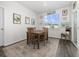 Small dining area with wooden table and chairs, hardwood floors, and a window with a view at 1143 Sennema Circle, Myrtle Beach, SC 29588