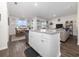 Open-concept kitchen featuring white cabinetry, granite island, and stainless steel appliances at 1143 Sennema Circle, Myrtle Beach, SC 29588