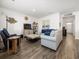 Bright and airy living room with hardwood floors, comfortable seating, and tasteful decor at 1143 Sennema Circle, Myrtle Beach, SC 29588